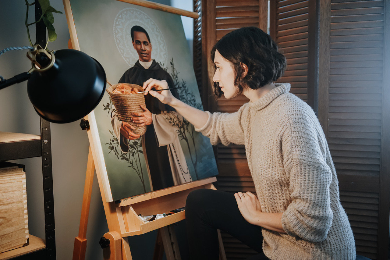 Tianna Williams, who painted “I Will Not Forget You,” which was featured on Bishop W. Shawn McKnight’s social media channels on Jan. 22, works on another artwork.